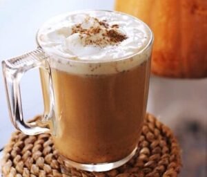 Delicious pumpkin spice latte topped with whipped cream, perfect for autumn indulgence.